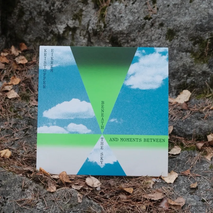 Beneath the Sky and Moments Between vinyl LP lying on gravel